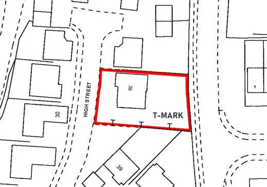 Close-up diagram of a T-mark on a boundary line, showing the foot pointing toward the responsible property